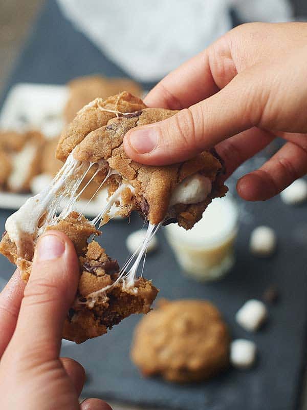 Marshmallow stuffed peanut butter cookie being pulled apart