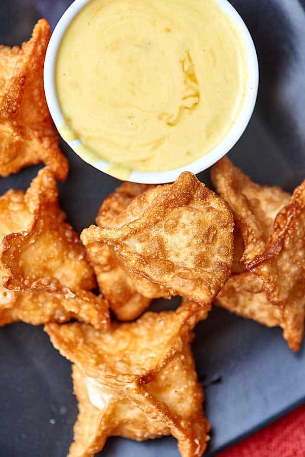 cheese wontons with honey mustard dipping sauce overhead