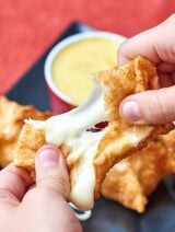 Cheese wontons with honey mustard dipping sauce! Seriously, what's better than that? Crispy fried golden wontons stuffed with gooey, melty cheese and dipped in sweet and tangy honey mustard. Perfection! www.showmetheyummy.com #cheese #wontons #honeymustard #appetizers