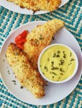 Sweet, salty, and a little bit spicy. These coconut chicken fingers are a great dinner for any age! A kicked up childhood favorite, that’s baked not fried! #chicken #chickenfingers #spicy #sweet #salty #fingerfood #dinner #kidfriendly #coconut