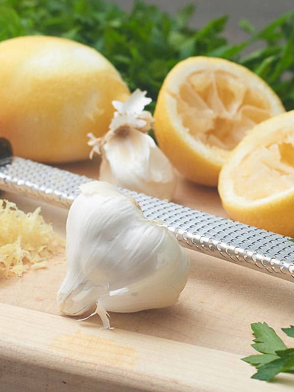 Lemon and garlic on a cutting board