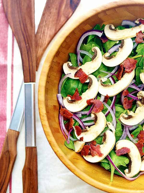 large bowl of spinach salad above