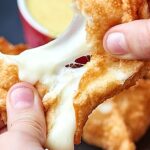 Cheese wontons with honey mustard dipping sauce! Seriously, what's better than that? Crispy fried golden wontons stuffed with gooey, melty cheese and dipped in sweet and tangy honey mustard. Perfection! www.showmetheyummy.com #cheese #wontons #honeymustard #appetizers