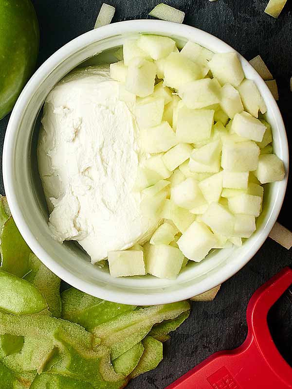 bowl of cubed apple and goat cheese