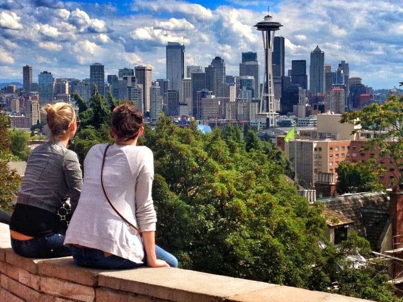 two women overlooking Seattle skyline