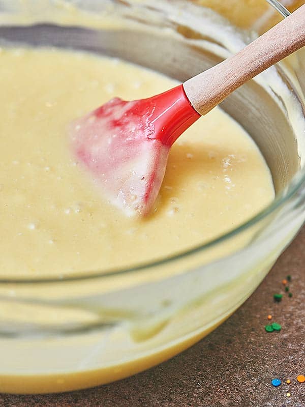 bowl of cake batter with spatula
