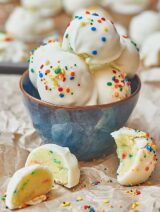 These lemon funfetti cake balls are moist, cakey and lemony on the inside, with a nice crunch from the outer shell of melted chocolate. These are a great dessert to make for all of those upcoming holiday parties, because they’re so darn good and easy, just use whatever cake/frosting combo you like! www.showmetheyummy.com #lemon #funfetti #cakeballs #cake #dessert