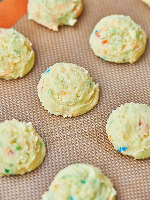 lemon funfetti cake balls on baking sheet