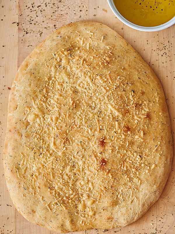 parmesan herbed focaccia on cutting board above