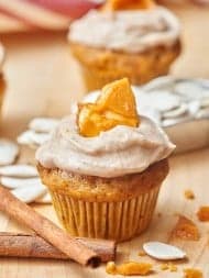 Pumpkin cupcakes w/ cinnamon cream cheese frosting and pumpkin seed brittle. showmetheyummy.com #dessert #pumpkin