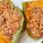 I grew up eating stuffed peppers that were filled with Rice-A-Roni, and although I love that recipe, I'm taking it up a notch by making my own filling of ground beef and rice. It's still simple, still delicious, and yes, it's still extra cheesy (the most important part). Cheese after all is the sixth food group! These cheesy stuffed peppers make a perfect warm, cozy meal, that will make your life a better place... if you like that kinda thing. showmetheyummy.com #stuffedpeppers #cheesystuffedpeppers #rice #groundbeef #easydinnerrecipe