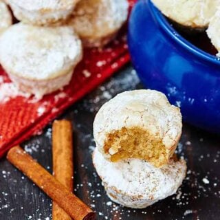 These eggnog donut muffins will be your best friend, greeting you cheerfully every morning and they go perfectly with that steaming hot cup of coffee. They are so tender, moist, and the eggnog flavor really comes through. The melted butter and powdered sugar really take these to the next level! showmetheyummy.com #donut #doughnut #muffin #powderedsugar #eggnog #breakfast #holiday #christmas