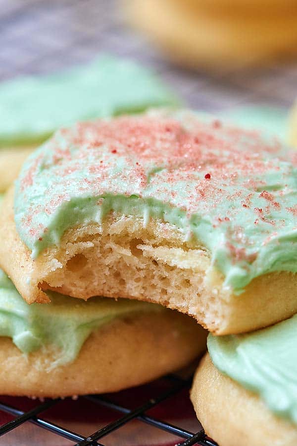 Soft, fluffy, perfectly sweet sugar cookies topped with the creamiest buttercream! Just like Grandma used to make! showmetheyummy.com #cookies #sugarcookies #holiday #baking #frosting #buttercream #frostedsugarcookies