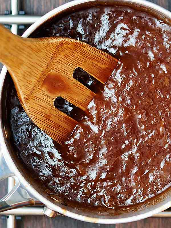 Pineapple sauce in saucepan above