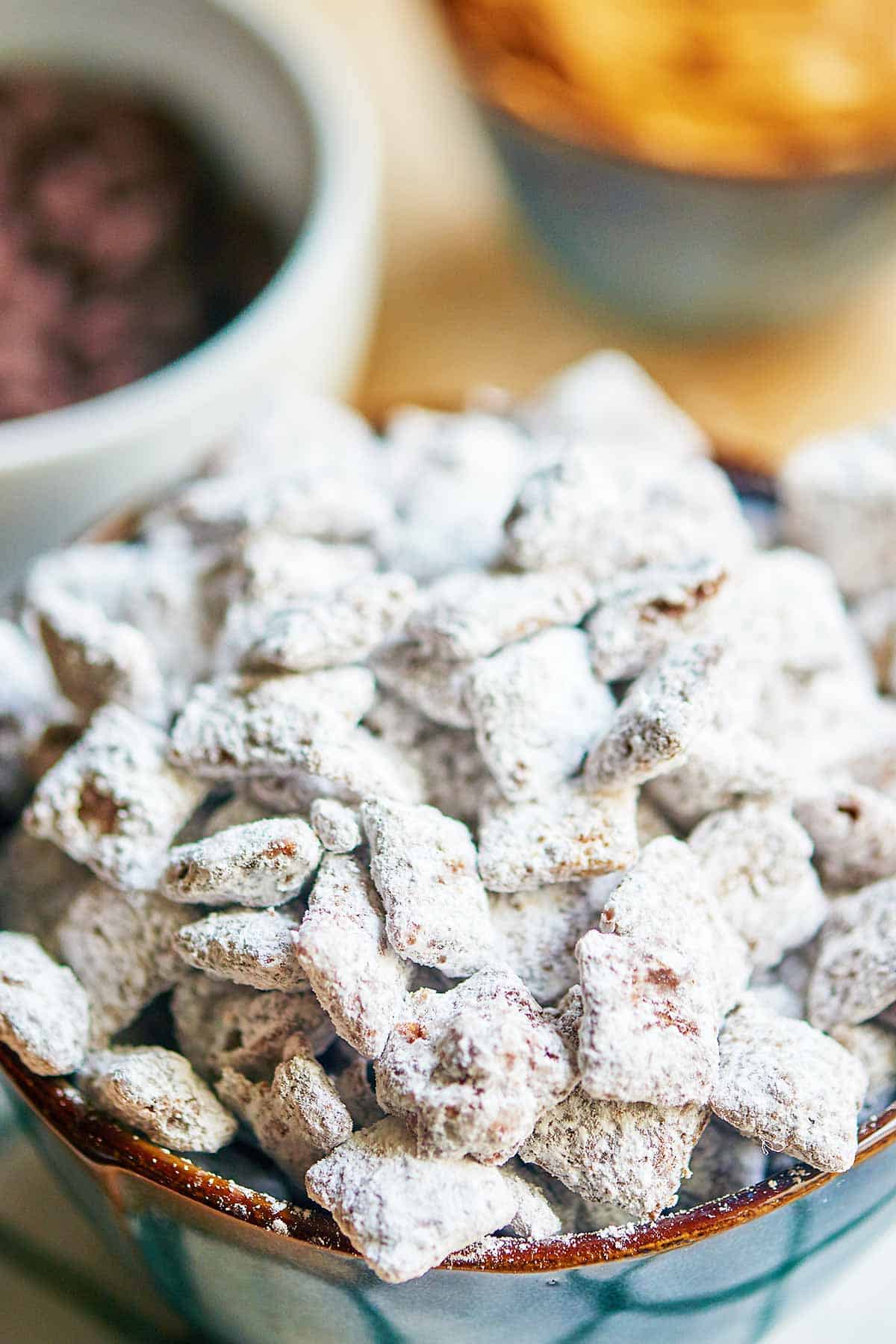 This is the best puppy chow recipe! Why? More chocolate, more peanut butter, more powdered sugar! This childhood classic aka muddy buddies just got better. showmetheyummy.com #puppychow #muddybuddies