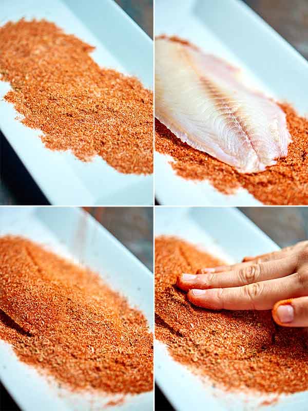 Tilapia being coated in spice rub