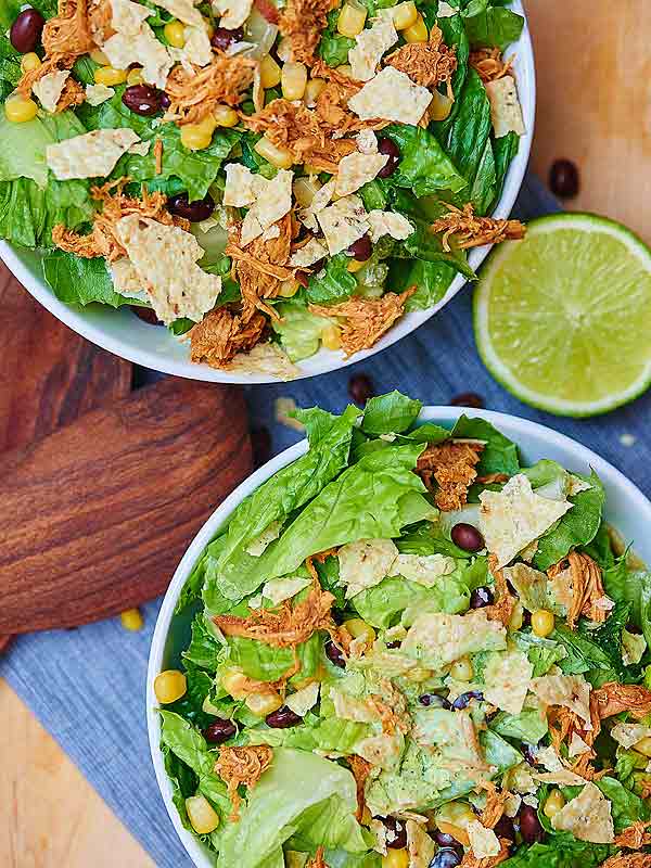 two plates of bbq chicken salad above