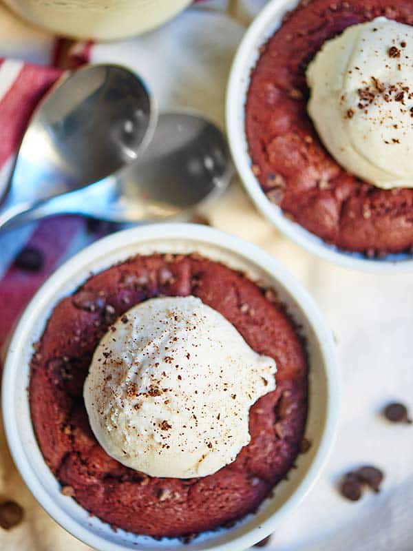 two deep dish red velvet cookies above