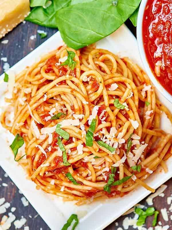 spaghetti with homemade spaghetti sauce on plate above