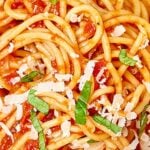 This homemade spaghetti sauce is well balanced and so versatile! Keep it simple and pour it over noodles, serve it up with chicken parmesan, or bake it into your favorite lasagna! This is a great options for vegans and vegetarians, too! The possibilities are endless! showmetheyummy.com #vegan #vegetarian #healthy #spaghetti #spaghettisauce #sauce