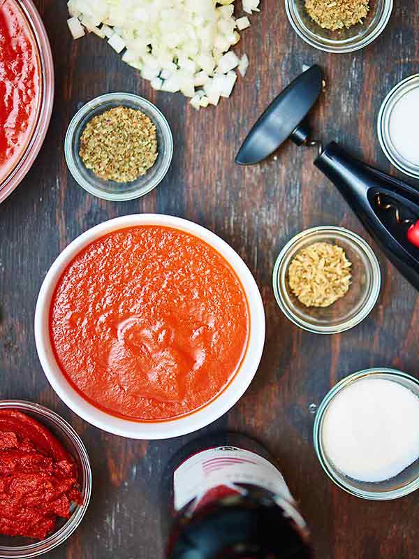 spaghetti sauce ingredients in separate bowls above