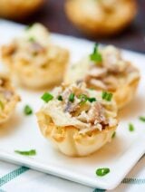 If you're looking for bite sized appetizers to serve a crowd, or just for a nice dinner at home for two, look no further because these mini caramelized onion, mushroom, and apple tarts are just a little sweet, a lot of savory, and have an amazing texture! Crunchy from the shell, and creamy and soft from the filling. The perfect bite if you ask me! showmetheyummy.com #appetizer #vegetarian #tart #appletart #oniontart #superbowl