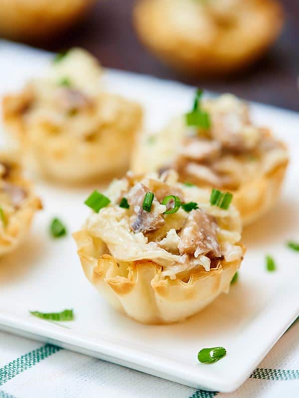 caramelized onion, mushroom, and apple tarts on plate