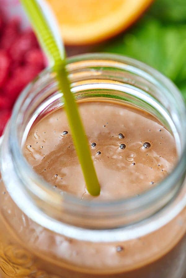 Jar of smoothie with straw