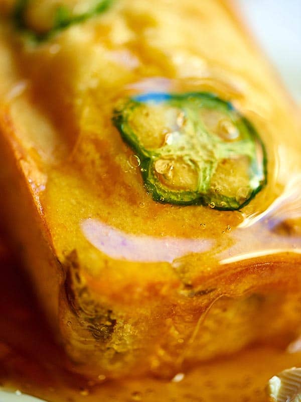 closeup of cornbread with honey