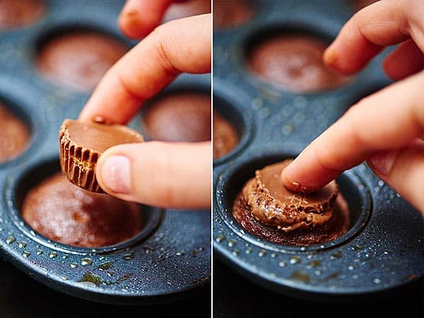 peanut butter cup being pushed into brownie