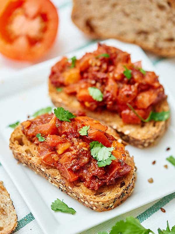 two pieces of bruschetta on plate