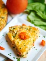 Crustless Goat Cheese Quiche. A great make ahead breakfast that you can just pop in the microwave all week! This quiche is creamy, packs in a ton of veggies, plus it's cheeeeesy and I love the classic combination of goat cheese and roasted red peppers! showmetheyummy.com #quiche #breakfast #glutenfree #vegetarian #goatcheese