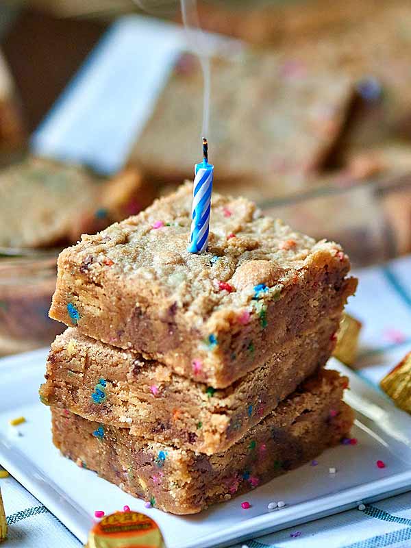 candle in stack of 3 golden oreo peanut butter blondies