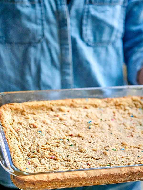 baking dish of golden oreo peanut butter blondies held