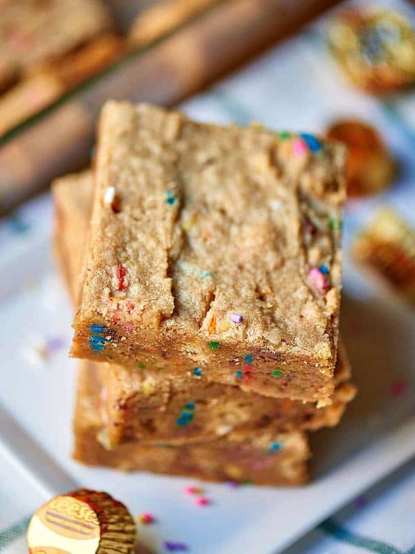 3 blondies stacked on plate above