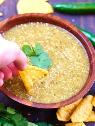 This homemade salsa verde has a whole lot going on! It's got a nice bite from the lime, a touch spicy from the serrano, and the cumin adds such a subtle but really great depth of flavor! showmetheyummy.com #salsa #mexican #vegetarian #vegan