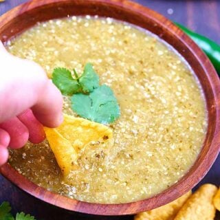 This homemade salsa verde has a whole lot going on! It's got a nice bite from the lime, a touch spicy from the serrano, and the cumin adds such a subtle but really great depth of flavor! showmetheyummy.com #salsa #mexican #vegetarian #vegan