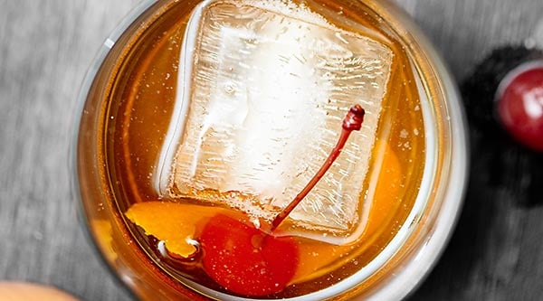 A classic cocktail that is enjoyed by many, an old fashioned cocktail recipe is made at home to be enjoyed whenever you like! showmetheyummy.com #whiskey #rye #bourbon #oldfashioned #cocktails #cherry #orange #bitters #sugar