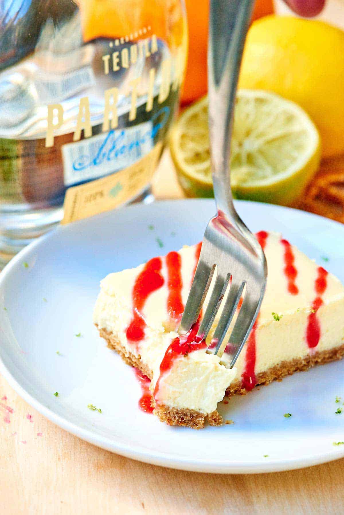 Tequila Lime Cheesecake Bars w/ Raspberry Sauce
