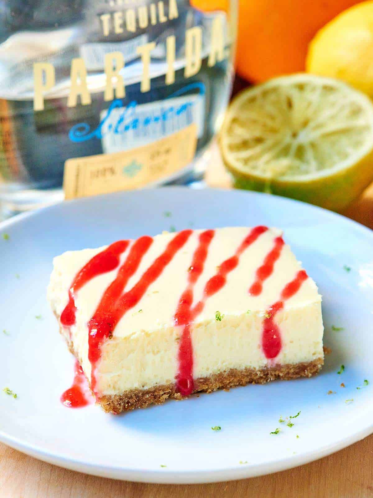 Tequila Lime Cheesecake Bars w/ Raspberry Sauce