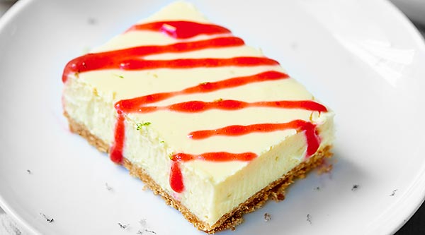 These tequila lime cheesecake bars are perfect for celebrating National Margarita Day! The slightly crunchy pretzel crust mimics the salty rim on a margarita and the cheesecake filling is so creamy and filled with cream cheese, lime juice, tequila, and grand mariner! It’s like eating your favorite margarita in bar form! ;) showmetheyummy.com #tequila #grandmariner #margarita #cheesecake #bars #pretzels #lime