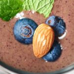 This chocolate berry green protein smoothie is so tasty, naturally sweetened, and packed full of nutrients! Less than 300 calories with 26 grams of protein. showmetheyummy.com #healthy #glutenfree #almonds #smoothie #spinach #breakfast #superfood