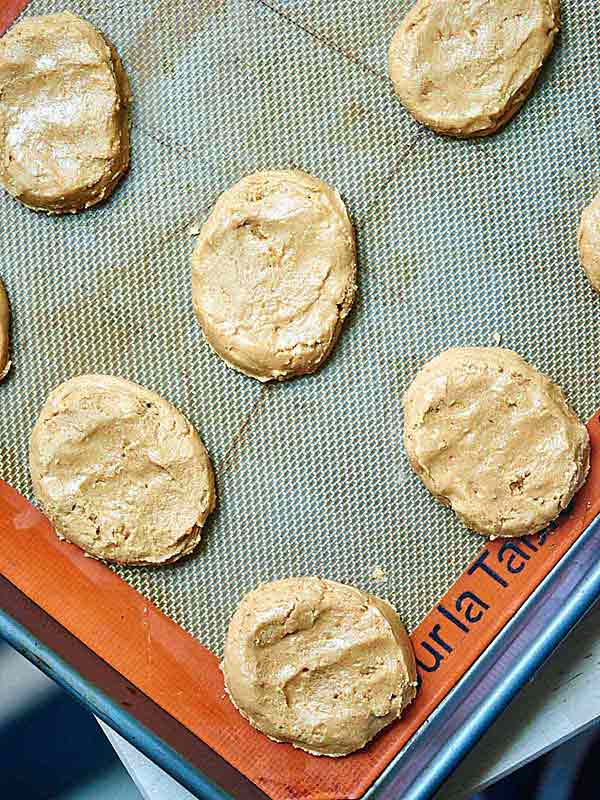 Peanut butter patties on baking sheet