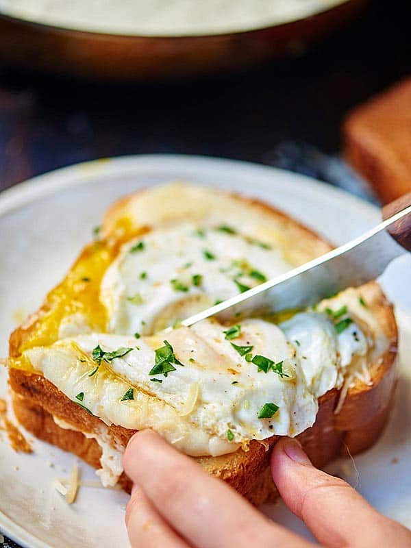 Sandwich being cut with a knife