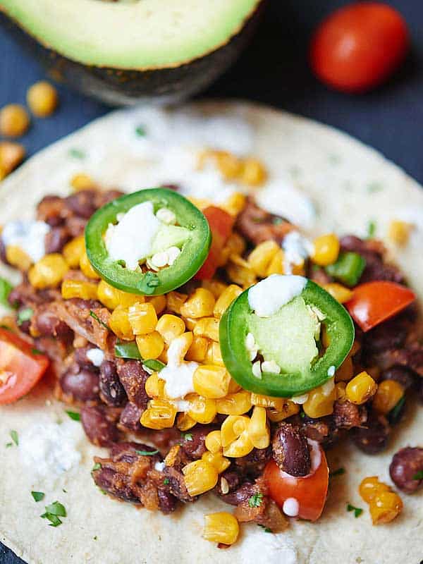 Closeup of black bean and corn taco