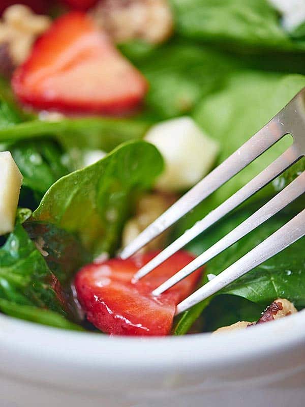 closeup of fork in salad