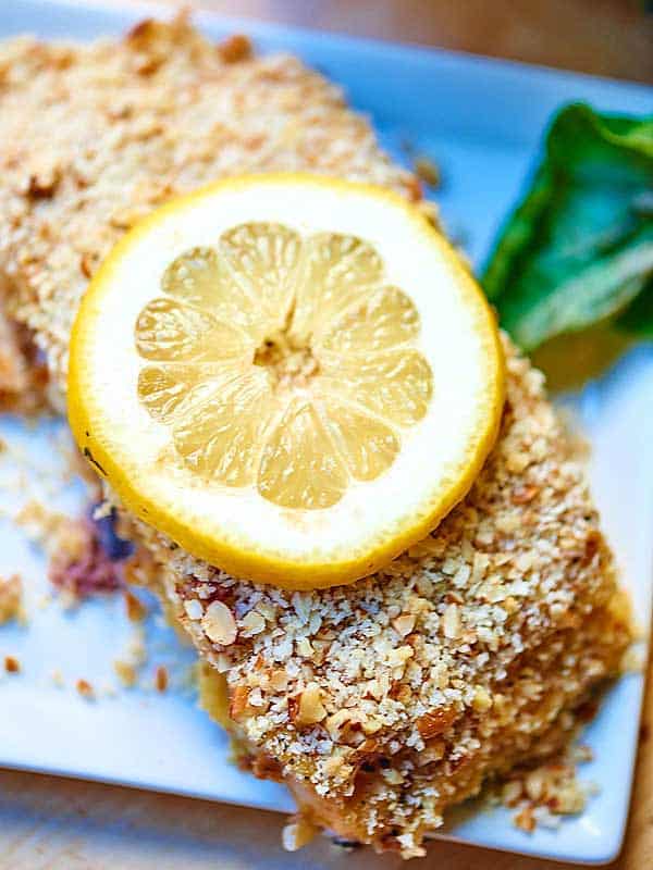 pecan crusted honey mustard salmon on plate above