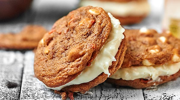 Carrot Cake Cookies with Toasted Coconut Cream Cheese Frosting. A sweet treat for Easter day! showmetheyummy.com #carrotcake #easter #creamcheese #frosting #coconut #cookies #spring