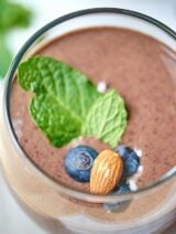This chocolate berry green protein smoothie is so tasty, naturally sweetened, and packed full of nutrients! Less than 300 calories with 26 grams of protein. showmetheyummy.com #healthy #glutenfree #almonds #smoothie #spinach #breakfast #superfood