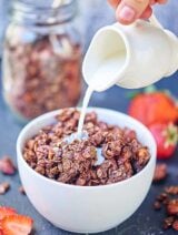 Double Chocolate Chip Granola. Healthy enough for breakfast, but indulgent enough for dessert! showmetheyummy.com #nuts #granola #breakfast #dessert #chocolate #coconutoil #honey #maplesyrup #glutenfree #vegetarian